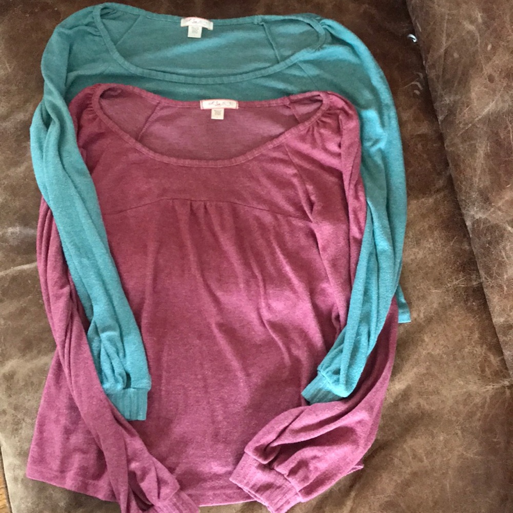 Two women’s peasant style sweaters.